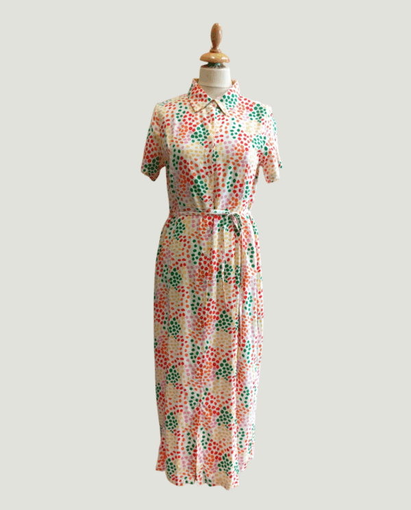 Abito donna con fantasia geometrica su base beige